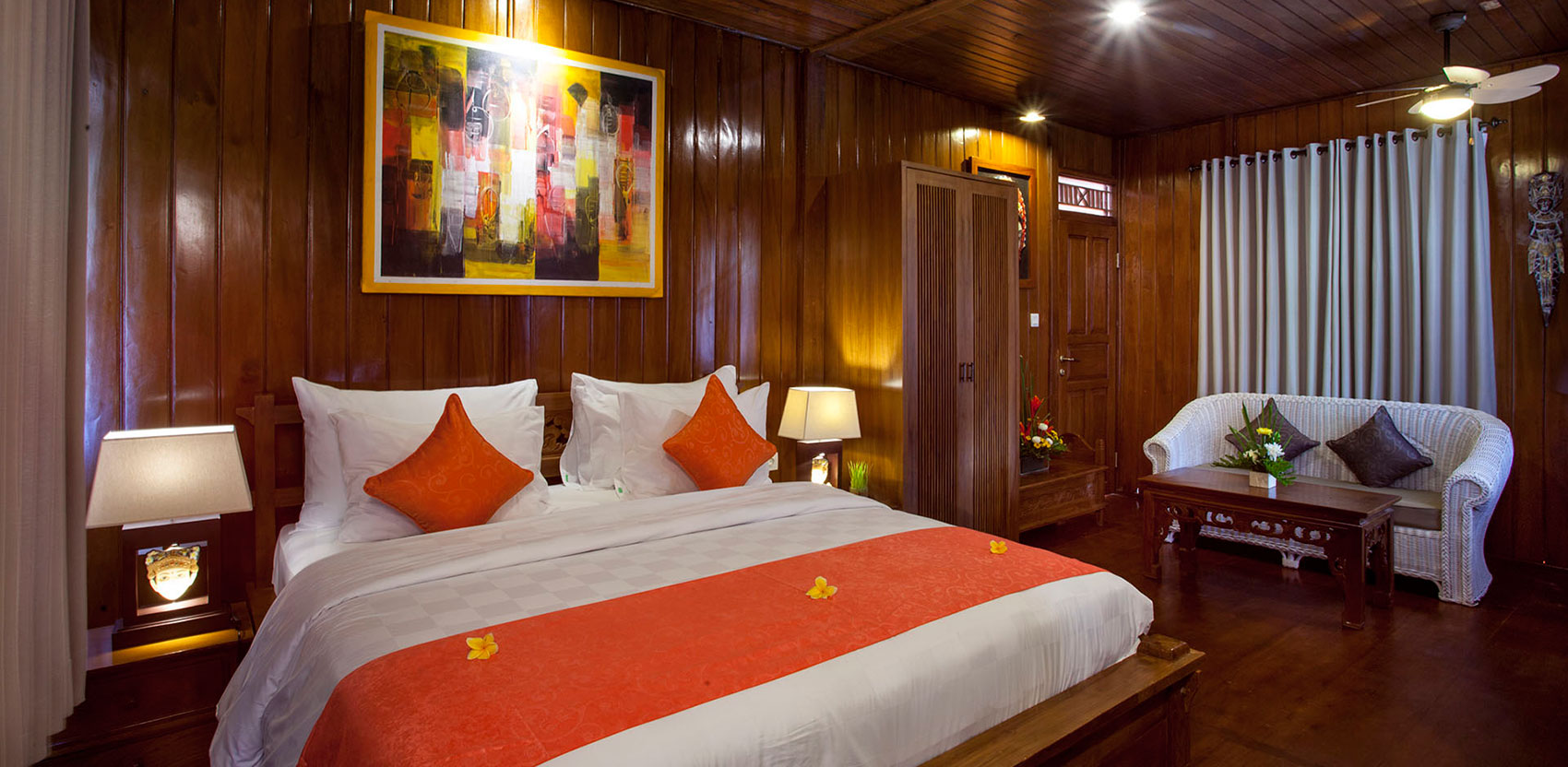 Kanti One Bedroom Garden Villa at Astagina Resort & Spa Bali, featuring traditional wooden interiors, and a luxury king bed.