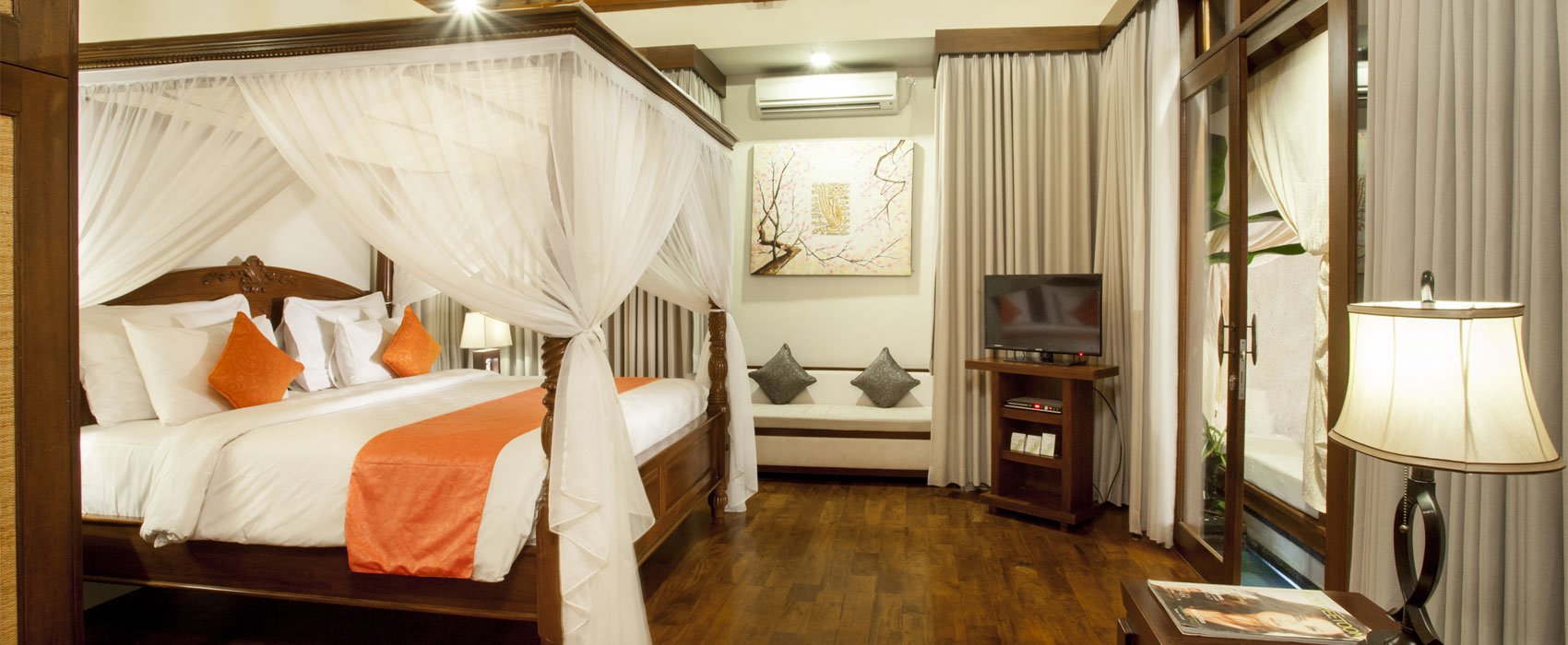 Master bedroom of Samboga Two Bedroom Pool Villa at Astagina Resort with direct pool views.
