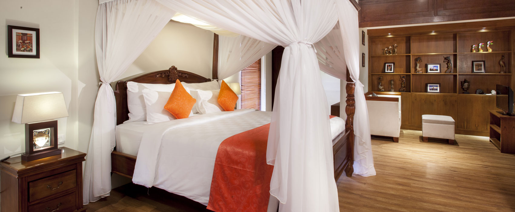Grand master bedroom of Kanaka Three Bedroom Royal Pool Villa at Astagina Resort with a luxury canopy bed.