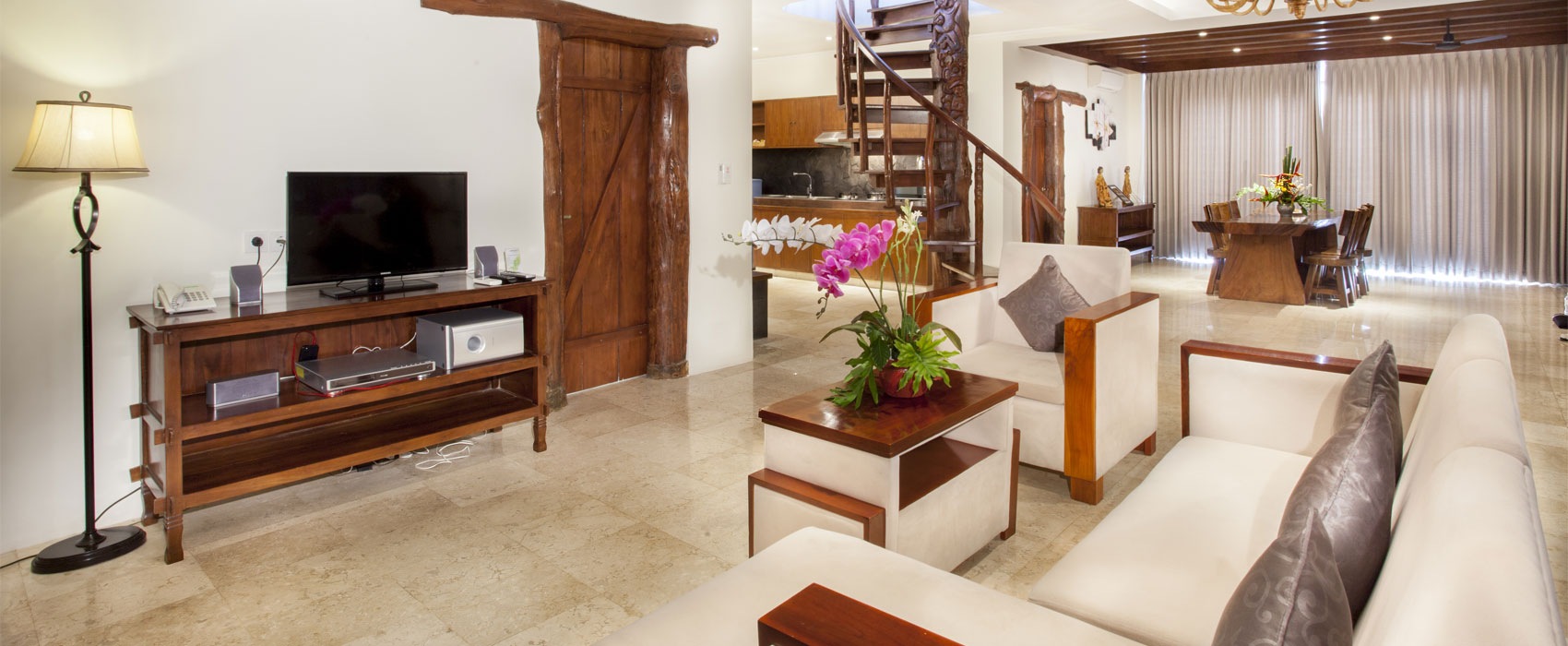 Expansive open-plan living and dining room in Kanaka Royal Pool Villa at Astagina Resort.