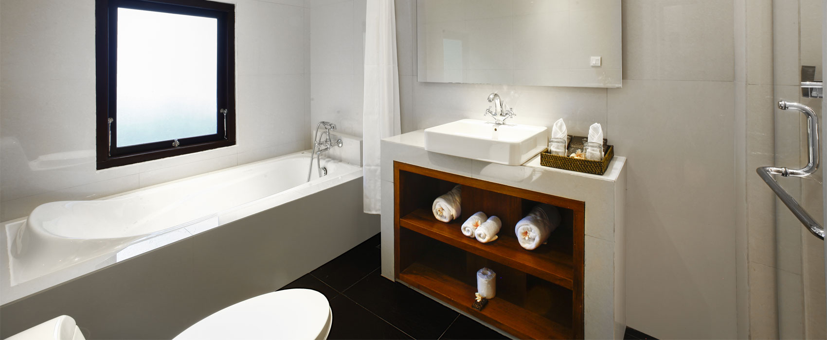 Elegant white bathroom at Purana Temple Villa with a large soaking tub.