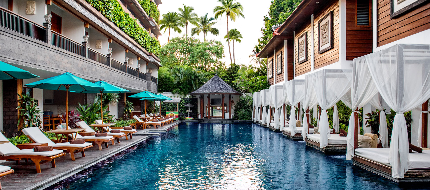 Outdoor main swimming pool at Astagina Resort Villa and Spa Bali