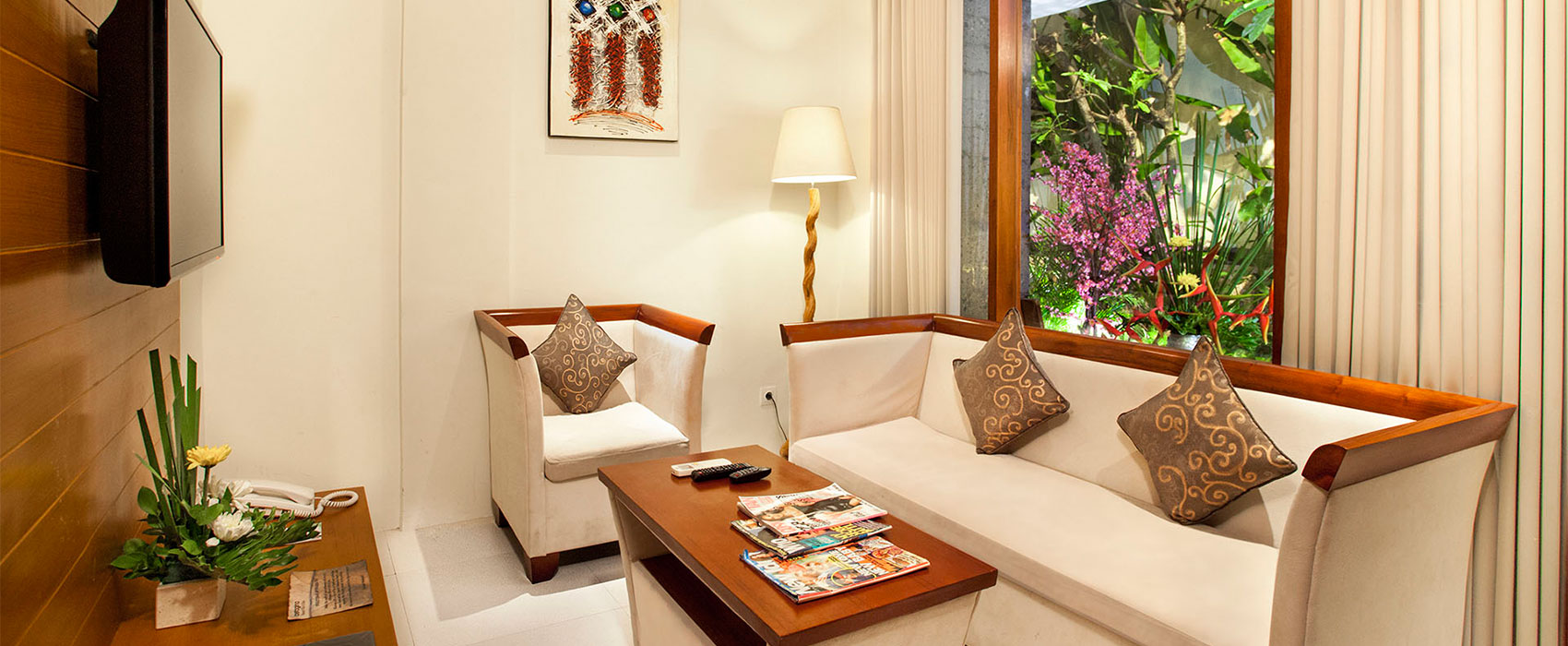 Modern 32” LED television mounted in a private villa living area at Astagina Resort.