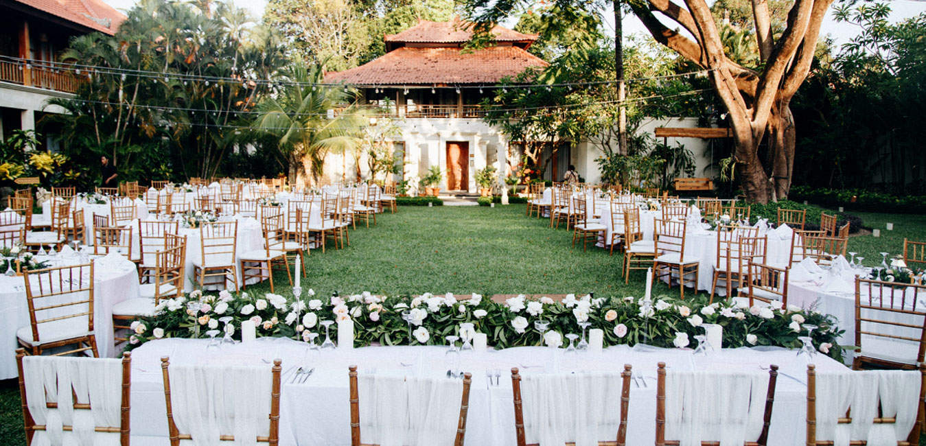 Luxury garden wedding venue at Astagina Resort & Spa Bali, featuring outdoor reception catering.