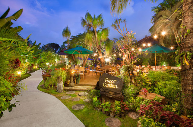 Casual outdoor beer garden venue for relaxing drinks at Astagina Resort Legian.
