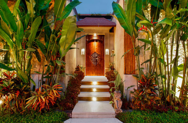 Traditional Balinese style villa entrance gate welcoming guests at Astagina Resort Villa and Spa.