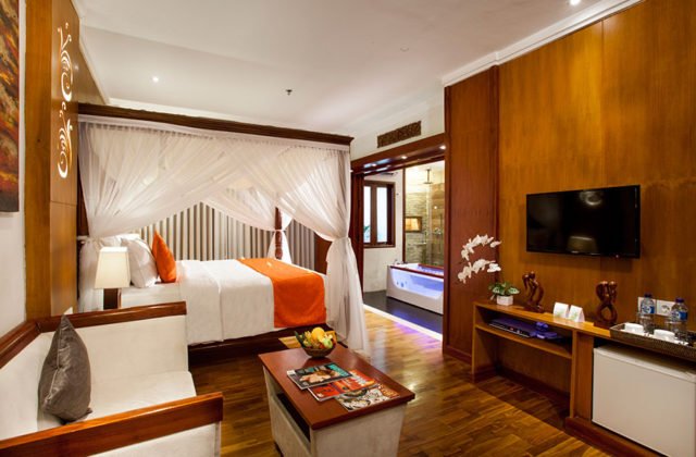Spacious interior layout of the Suite room featuring modern design and warm lighting at Astagina Resort.