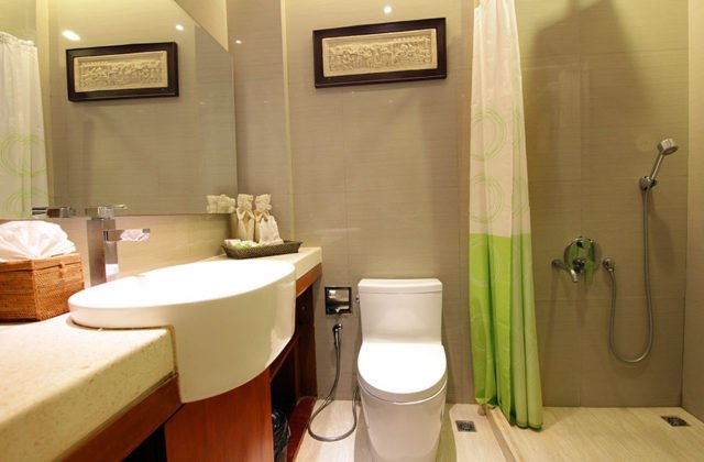Clean and modern toilet facility with washbasin in the en-suite bathroom at Astagina Resort.
