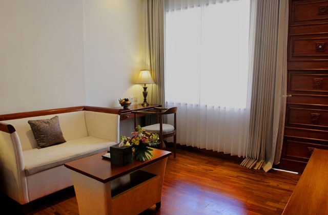 Plush and comfortable sofa sitting area inside the guest room for leisure and relaxation.