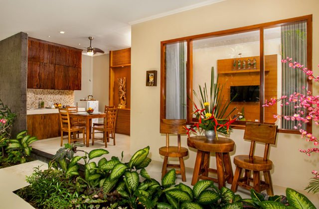Exterior facade of the private villa featuring a visible upper-level dining balcony area at Astagina Resort.