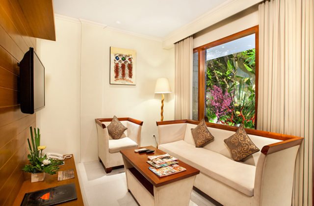 Spacious and comfortable living room interior area designed for relaxation within the private villa.