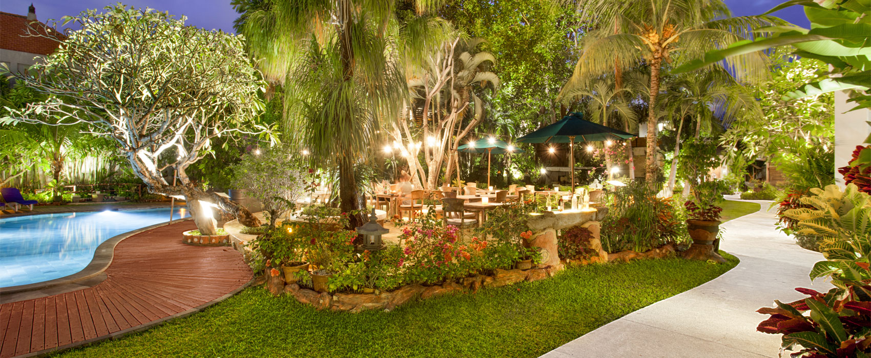 Beautifully lit outdoor beer garden and dining area at Astagina Resort.