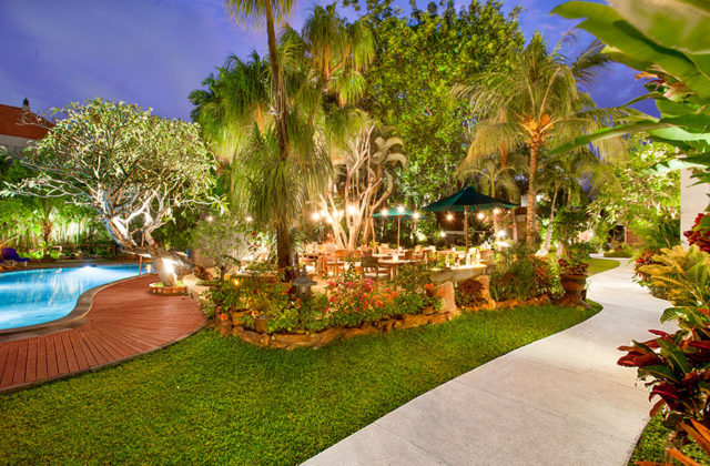Poolside beer garden seating area with refreshing views of the swimming pool at Astagina Resort.