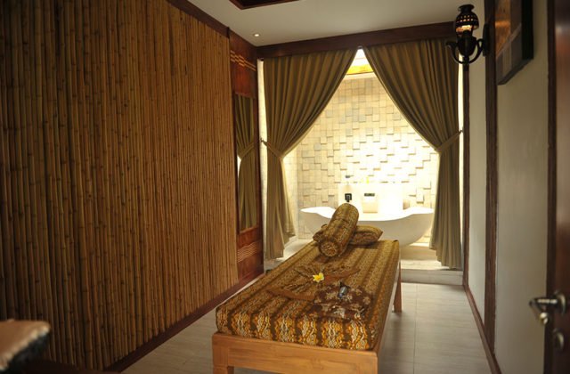 Luxury spa treatment room featuring a private soaking bathtub facility at Astagina Resort.