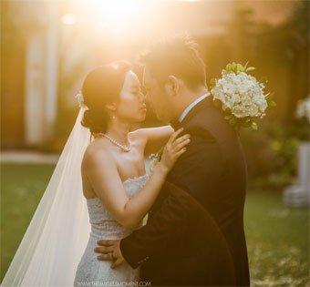 Romantic sunset wedding portrait of a bride and groom at Astagina Resort.