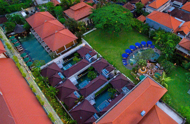 Aerial view showing the private villa layout and tropical greenery of Astagina Resort Bali.