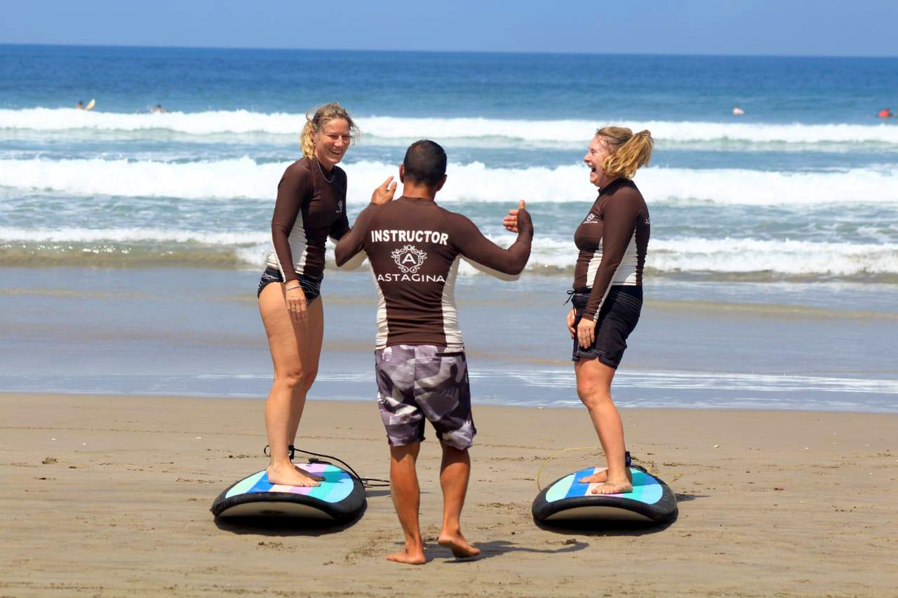 Surfing activity at the beach near Astagina Resort Villa and Spa Legian Bali.