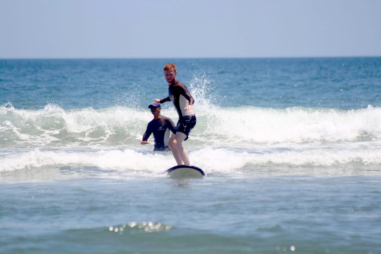 Exciting surfing activity at Double Six beach near Astagina Resort Villa and Spa.