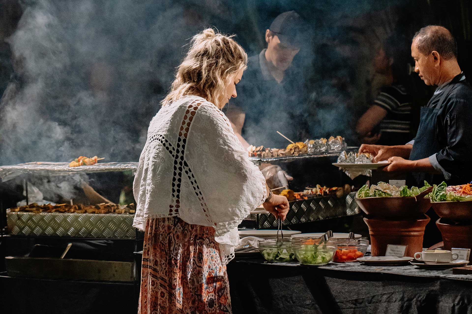 Guests enjoying a warm and delicious BBQ dinner evening at Astagina Resort Legian Bali.