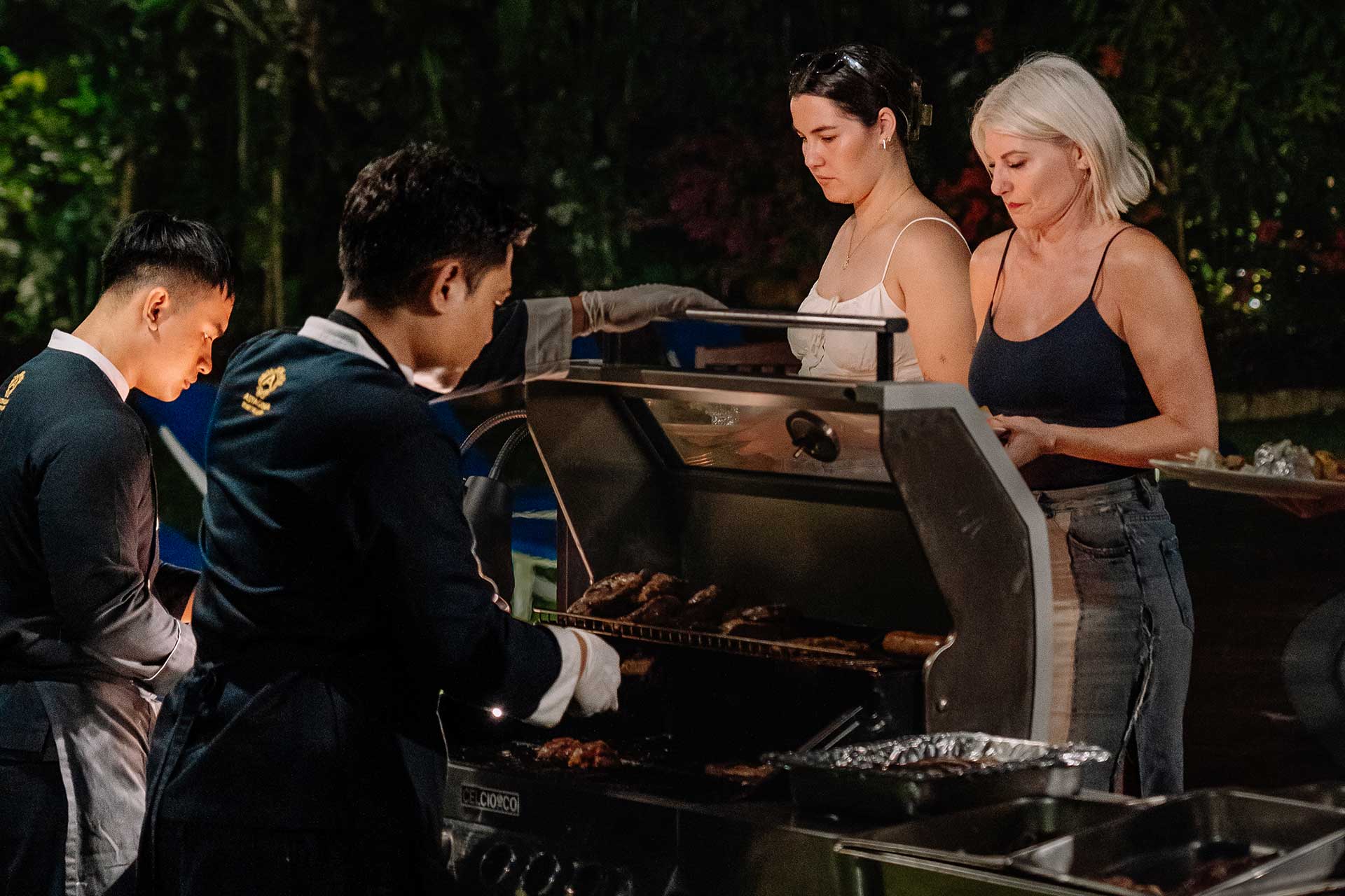 Outdoor BBQ dinner station and grilling setup at Astagina Resort Villa and Spa.
