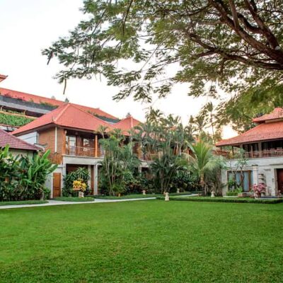 Beautifully manicured tropical garden landscape creating a green oasis at Astagina Resort Legian.
