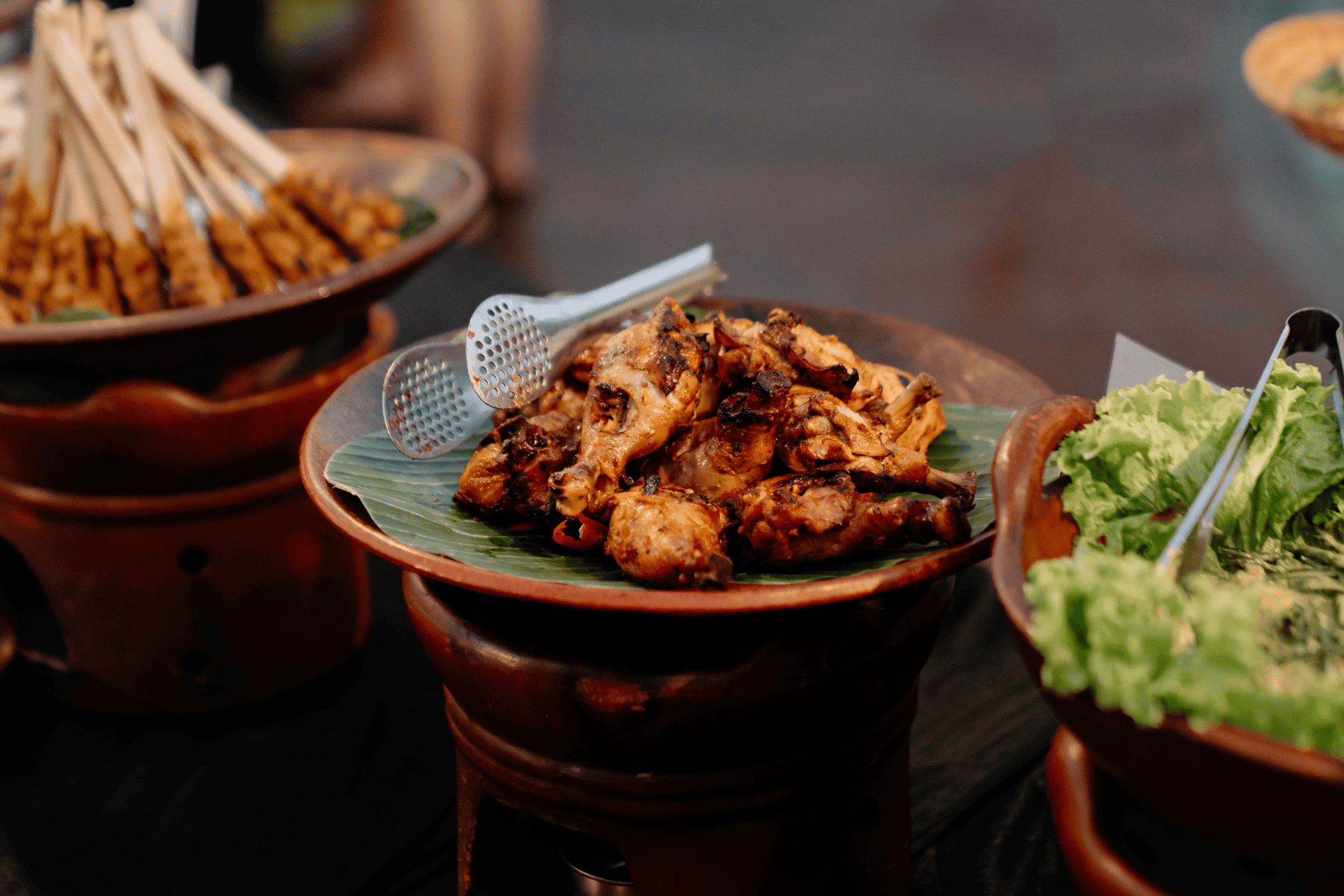 Platter of authentic traditional local cuisine featuring Chicken Satay at Astagina Resort.