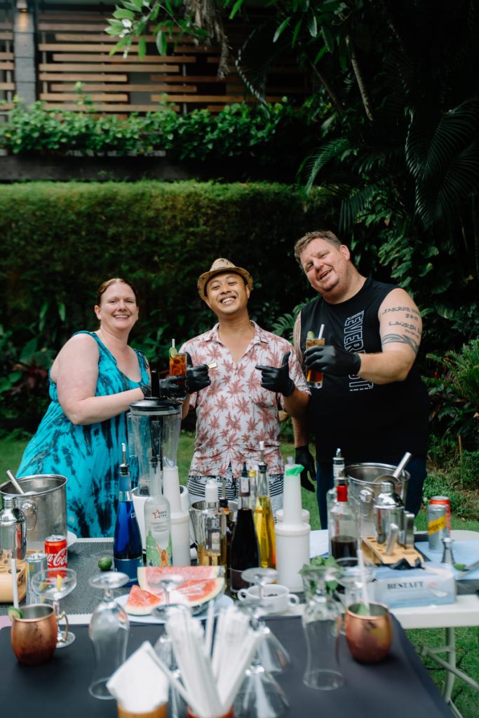 Happy guests enjoying a Mixology Maestro Class with the resort bar team at Astagina Resort Villa and Spa in Legian, Bali.